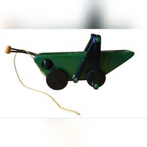 handcrafted wooden grasshopper pull toy